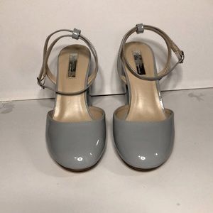Powder blue closed toe heels. Ankle strap and angular heel. Gently worn